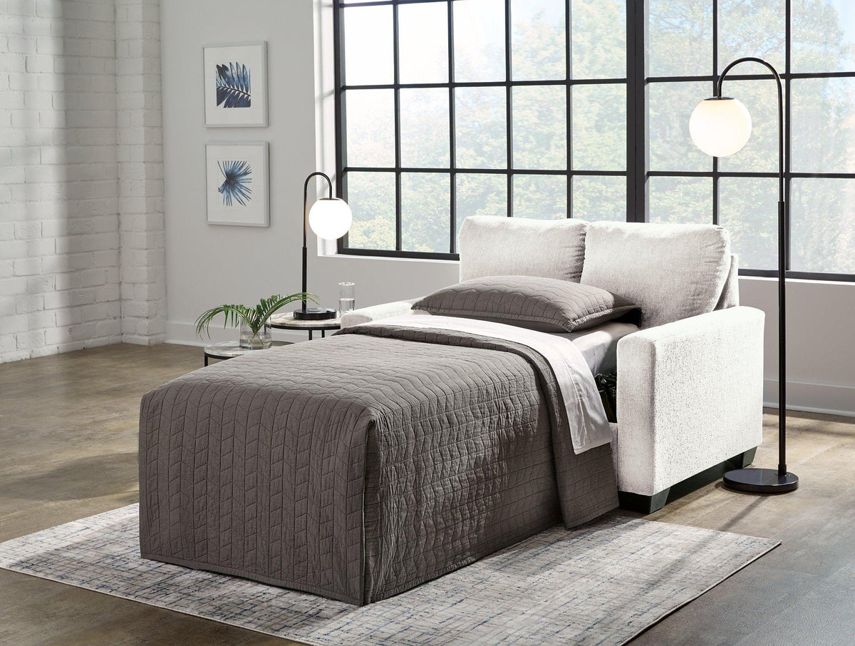Ashley Furniture Rannis sofa sleeper featuring a modern design with plush cushions and a pull-out bed for versatile comfort.