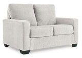 Ashley Furniture Rannis sofa sleeper with plush fabric and convertible design, ideal for comfortable lounging and sleeping.