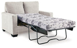Ashley Furniture Rannis sofa sleeper with plush cushions and convertible design, ideal for versatile seating and sleeping space.