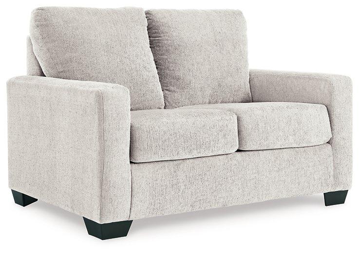Ashley Furniture Rannis sofa sleeper with plush upholstery and fold-out bed for versatile seating and sleeping comfort.
