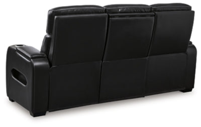 Ashley Furniture Boyington power reclining sofa showing plush back cushions and reclining mechanism in a modern living room setting.