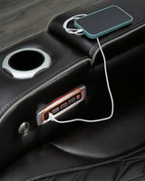 Close-up of the Ashley Furniture Boyington Power Reclining Sofa arm showing detailed stitching and plush cushioning.