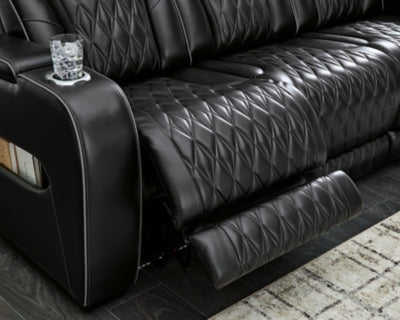 Ashley Furniture Boyington Power Reclining Sofa with plush cushions and reclining features, shown in a modern living room setting.