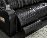 Ashley Furniture Boyington Power Reclining Sofa with plush cushions and reclining features, shown in a modern living room setting.
