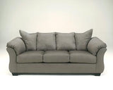 Ashley Furniture Darcy Sofa with plush fabric and modern design, featuring wide cushions and sleek armrests.