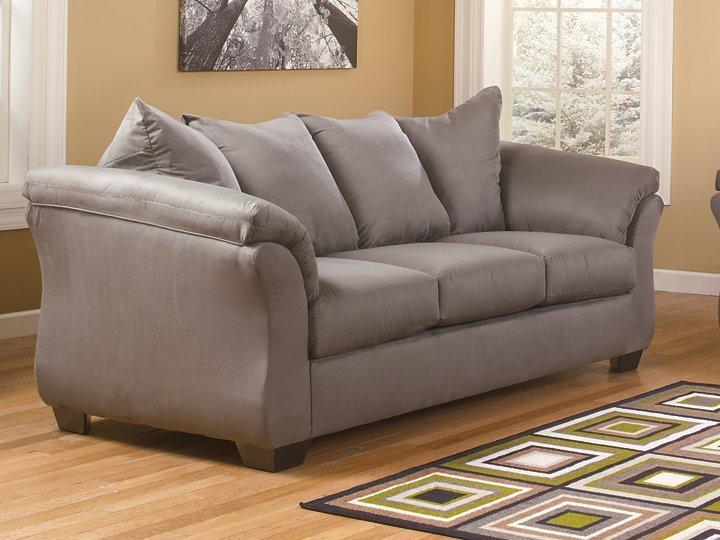Ashley Furniture Darcy Sofa with plush fabric upholstery and sleek design, shown in a modern living room setting.