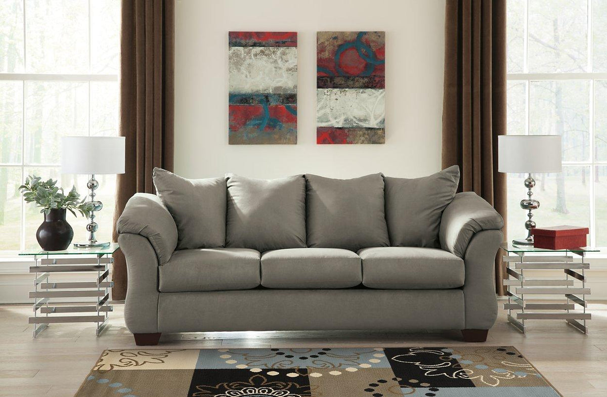 Ashley Furniture Darcy Sofa showing plush fabric upholstery, cushioned backrest, and armrests in a modern living room setting.