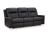 Ashley Furniture Mackmenville reclining sofa shown from a side angle, featuring plush cushions and a modern design.