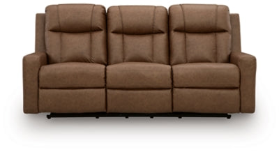 Ashley Furniture Mackmenville Reclining Sofa with plush cushions and wood accents, shown from a front head-on view.