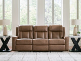 Ashley Furniture Mackmenville reclining sofa with plush fabric and padded armrests, shown in a closed position.