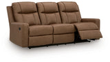 Ashley Furniture Mackmenville reclining sofa shown from an angled open position, featuring plush cushions and a modern design.