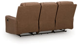 Ashley Furniture Mackmenville reclining sofa with plush cushions and dark brown upholstery, shown from the back view.