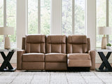 Ashley Furniture Mackmenville reclining sofa in open position, plush fabric with padded armrests and comfortable seating.