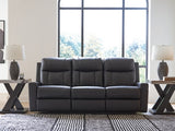 Ashley Furniture Mackmenville reclining sofa with plush cushions and fabric upholstery, shown in a closed reclining position.