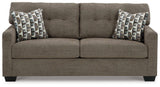 Ashley Furniture Mahoney sofa with plush cushions and modern design, shown in a cozy living room setting.