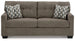 Ashley Furniture Mahoney sofa with plush cushions and modern design, shown in a cozy living room setting.