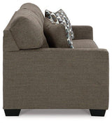 Mahoney sofa by Ashley Furniture featuring plush cushions, neutral upholstery, and a modern design perfect for living rooms.