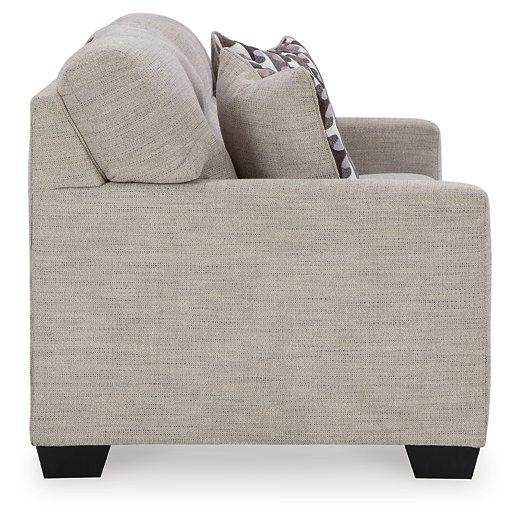 Comfortable Ashley Mahoney sofa with plush cushions and neutral fabric, perfect for modern living rooms.