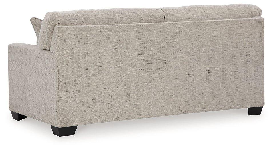 Ashley Furniture Mahoney sofa with plush cushions and neutral fabric, showcasing a modern design in a living room setting.