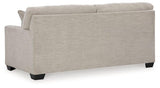 Ashley Furniture Mahoney sofa with plush cushions and neutral fabric, showcasing a modern design in a living room setting.