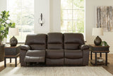 Ashley Furniture Leesworth power reclining sofa with plush cushions and dark leather upholstery, shown from a front angle.