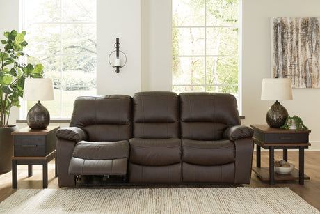 Ashley Furniture Leesworth power reclining sofa with plush cushions and dark leather upholstery, shown from a front angle.
