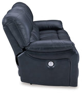 Ashley Furniture Leesworth power reclining sofa with plush cushions and dark upholstery, shown from a side view.