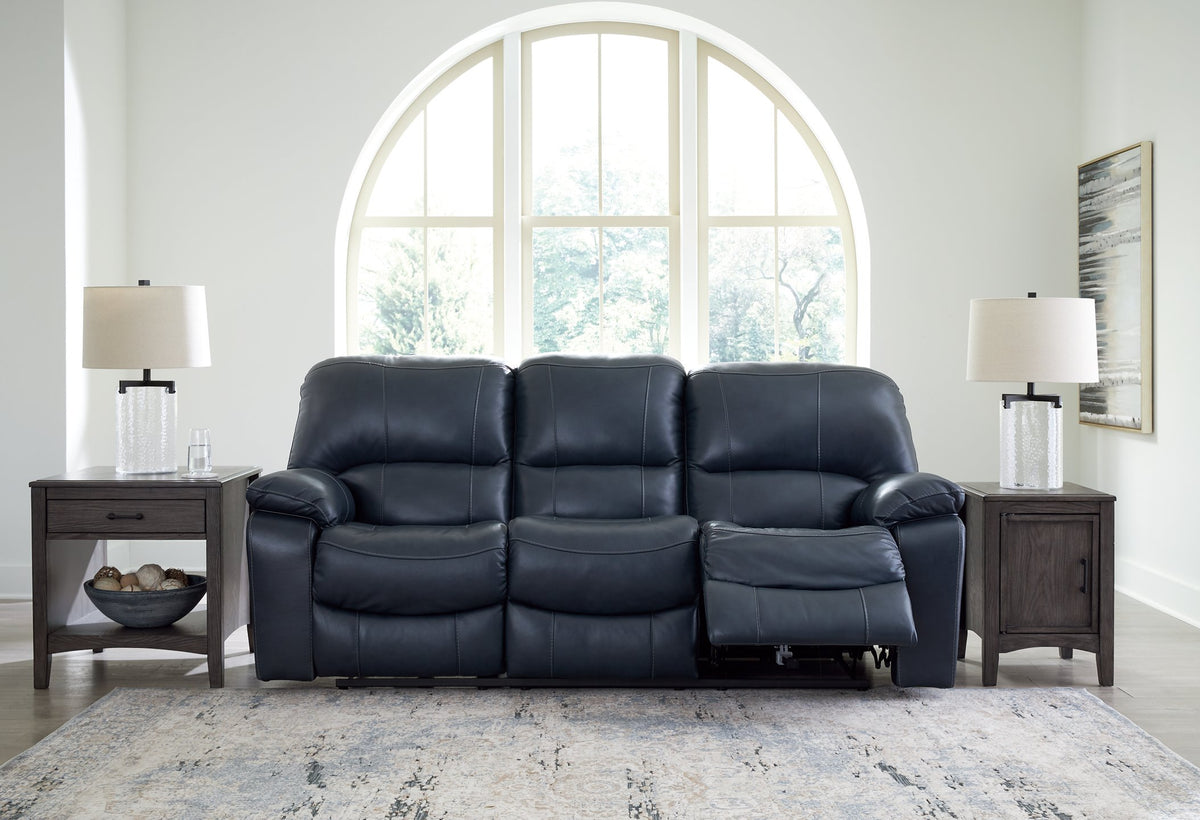 Ashley Furniture Leesworth power reclining sofa with plush cushions and wide armrests, shown in an open reclining position.