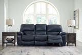 Ashley Furniture Leesworth power reclining sofa with plush cushions and wide armrests, shown in an open reclining position.