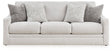 Ashley Furniture Adda sofa with plush cushions and neutral fabric, shown head-on in a modern living room setting.