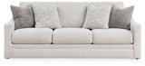 Ashley Furniture Adda sofa with plush cushions and neutral fabric, shown head-on in a modern living room setting.