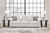 Ashley Furniture Adda sofa in neutral fabric with plush cushions and modern design, perfect for living room comfort.