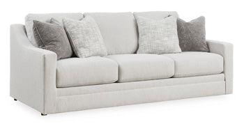 Ashley Furniture Adda Sofa shown from an angled view, featuring plush cushions and modern design in a living room setting.