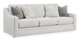 Ashley Furniture Adda Sofa shown from an angled view, featuring plush cushions and modern design in a living room setting.