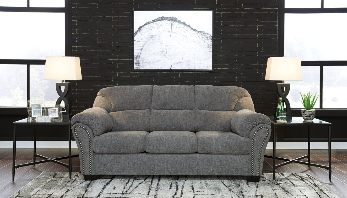 Ashley Furniture Allmaxx sofa with plush cushions and modern design, shown in a stylish living room setting.