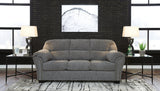 Ashley Furniture Allmaxx sofa with plush cushions and modern design, shown in a stylish living room setting.