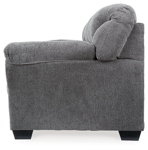 Ashley Furniture Allmaxx sofa with plush cushions and neutral fabric, shown in a modern living room setting.