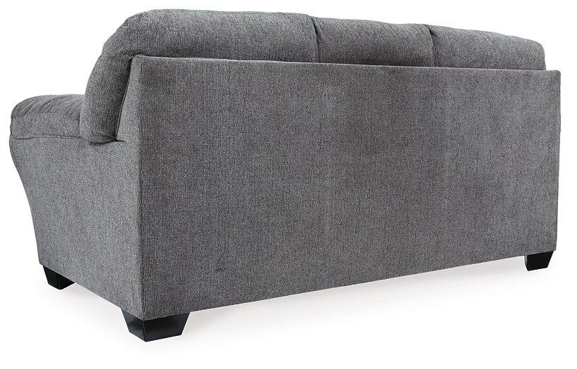 Ashley Furniture Allmaxx sofa with plush cushions and modern design, shown in a stylish living room setting.