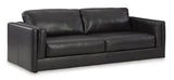 Ashley Furniture Amiata Sofa with plush beige upholstery and modern design, shown in a stylish living room setting.