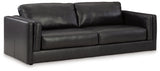 Ashley Furniture Amiata sofa shown from an angled view, featuring plush cushions and modern design in a stylish living room setting.