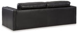 Ashley Furniture Amiata sofa with plush back cushions and contemporary design, shown from the rear view.