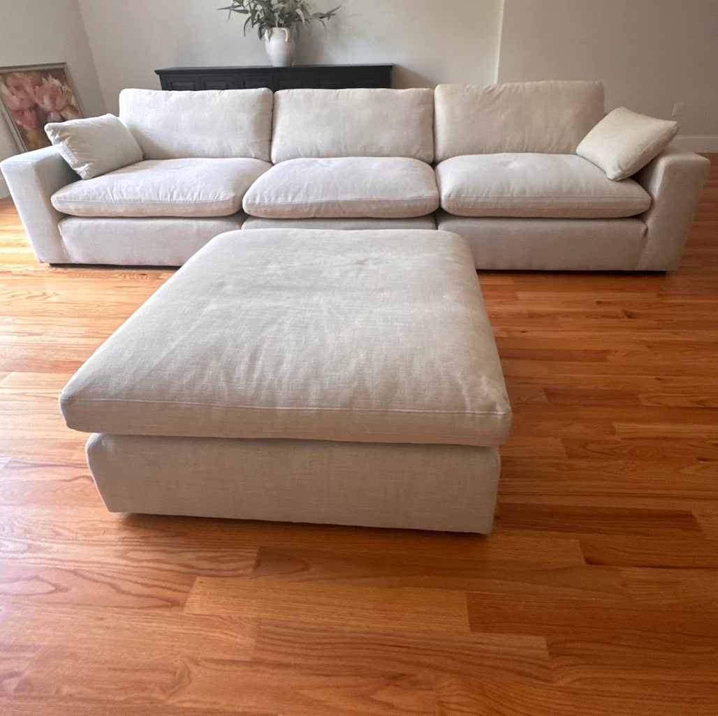 Ashley Furniture Atlas Cloud Modular Sofa, a 3-piece sectional with plush cushions and modern design, shown in a living room setting.