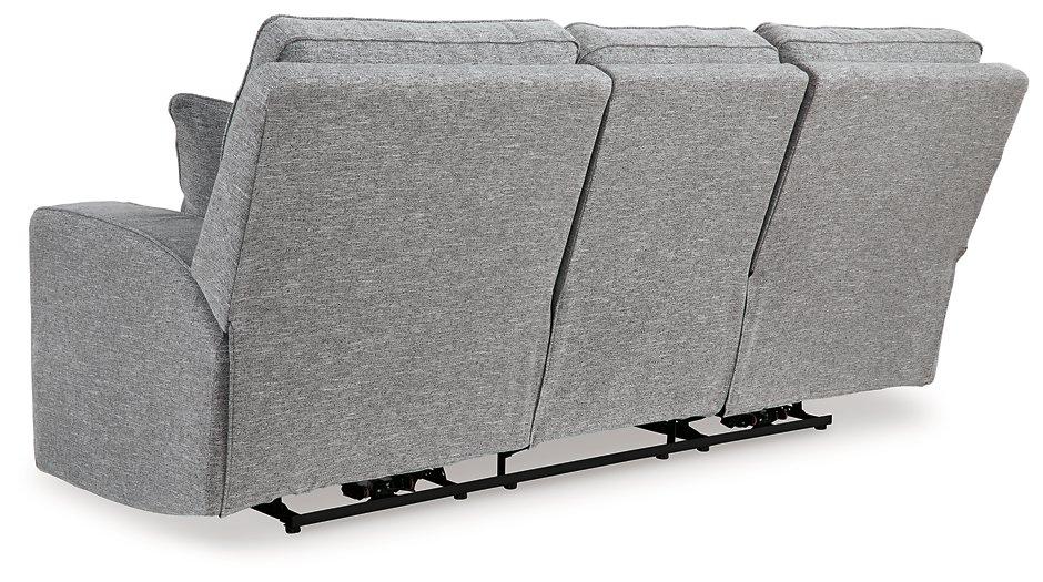 Ashley Furniture Biscoe Power Reclining Sofa with plush cushions and reclining feature, shown in a modern living room setting.