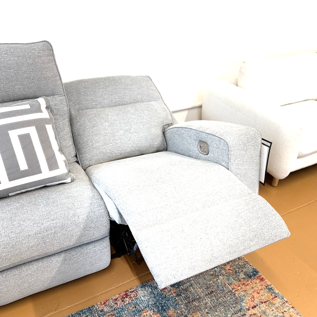 Ashley Furniture Biscoe Power Reclining Sofa with plush cushions and built-in recline controls, perfect for relaxing comfort.