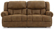 Ashley Furniture Boothbay Power Reclining Sofa with plush cushions and dark fabric upholstery, perfect for relaxing in style.