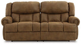 Ashley Furniture Boothbay Power Reclining Sofa with plush cushions and dark fabric upholstery, perfect for relaxing in style.