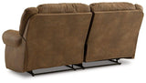 Ashley Furniture Boothbay Power Reclining Sofa with plush cushions and reclining features, shown in a cozy living room setting.