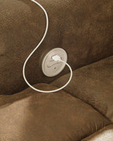 Ashley Furniture Boothbay power reclining sofa with plush cushions and reclining features, shown in a modern living room setting.