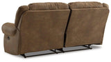 Ashley Furniture Boothbay reclining sofa showing plush gray fabric, cushioned armrests, and built-in recliner mechanisms.
