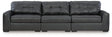 Ashley Furniture Brindley sectional sofa with plush cushions and modern design, shown in a cozy living room setting.